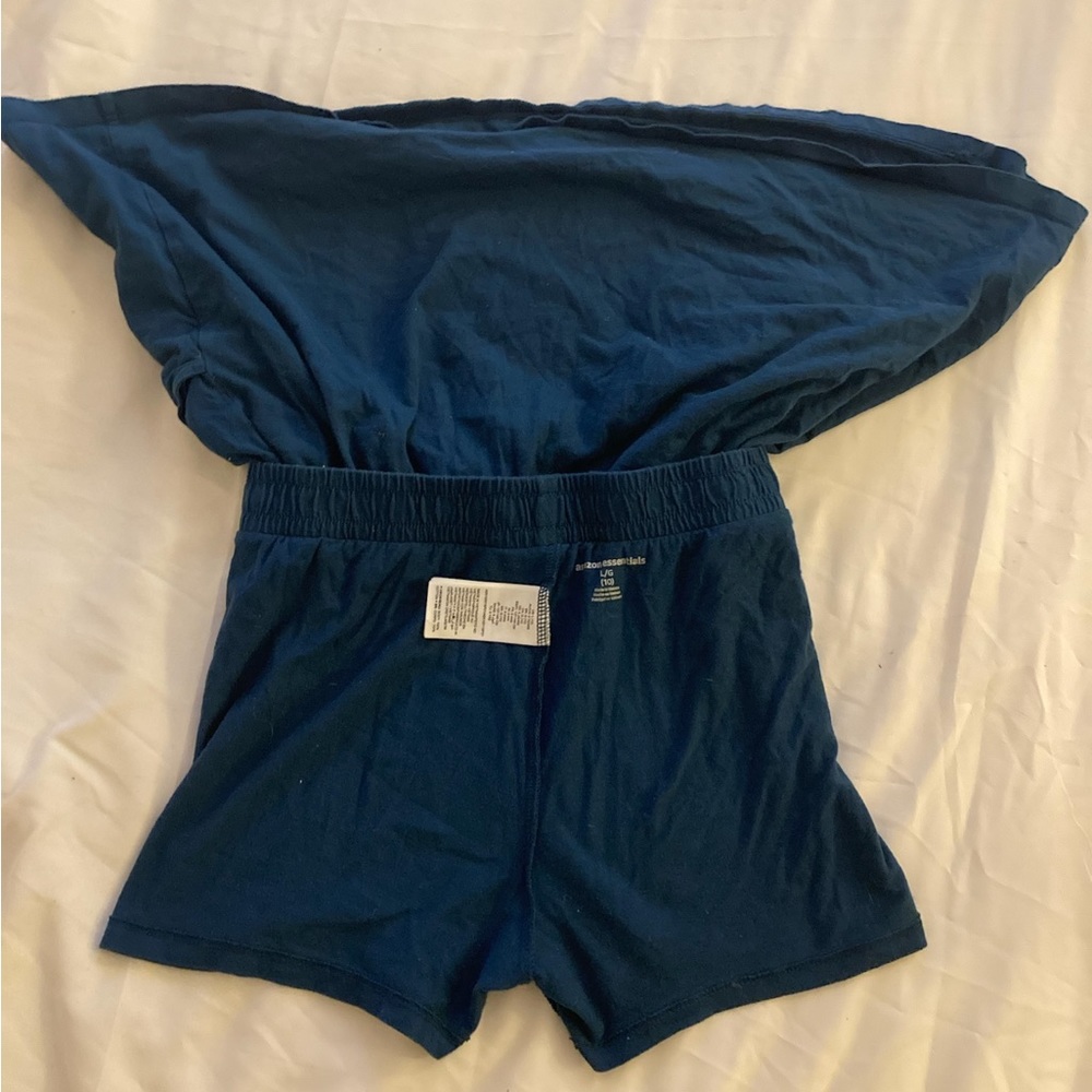 Skirt with built in shorts, navy blue, two pockets on side, and white drawstring